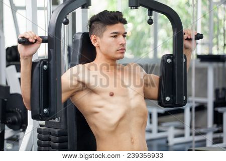 Muscular Bodybuilder Guy Doing Heavy Weight Exercise For Chest In The Gym .sport Young Fitness Man T