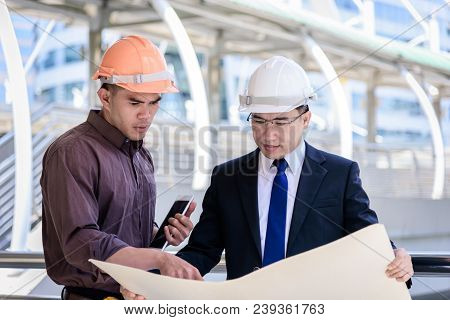 Two Asian Business And Engineer Man Has Planning And Working For Design Buiding And City.