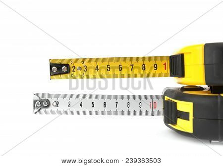 Metal Self-retracting Measuring Tapes On White Background