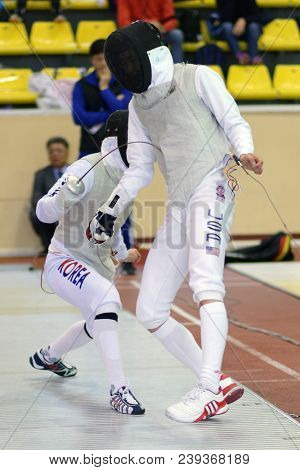 ST. PETERSBURG, RUSSIA - MAY 4, 2018: Philip Shin, USA vs Dong Jin Han, Korea in first competition day of Fencing World Cup Saint-Petersburg Foil. This annual tournament is hold in 44th time
