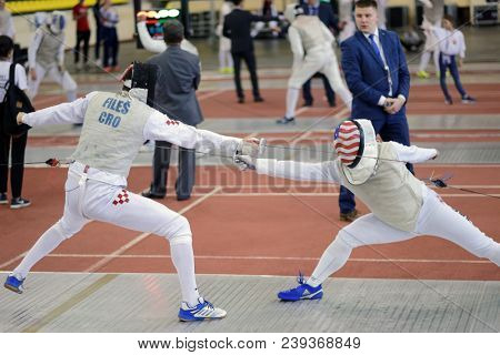 ST. PETERSBURG, RUSSIA - MAY 4, 2018: Petar Files, Croatia vs Jerry Chang, USA in first competition day of Fencing World Cup Saint-Petersburg Foil. This annual tournament is hold in 44th time