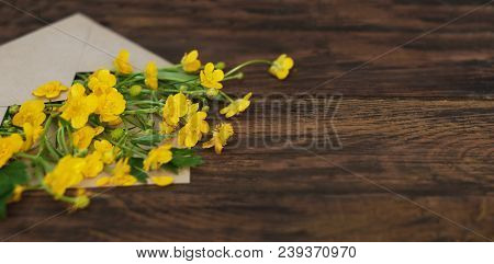 Yellow Little Flowers In Envelope Rustic Wooden Background Banner