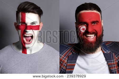 Emotional Soccer Fans With Painted England And Tunisia Flags On Faces. Confrontation Of Football Tea