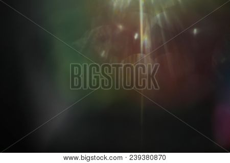 Lens Flare. Colorful Abstract. Bokeh Light On Black Background. Ray Leak