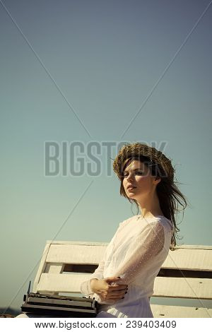 Woman Typing On Typewriter On Blue Sky. Assistant Or Secretary Working On Nature On Sunny Day. Summe