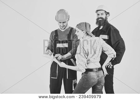 Technical Task Concept. Brigade Of Workers, Builders In Helmets, Repairers And Lady Discussing Contr