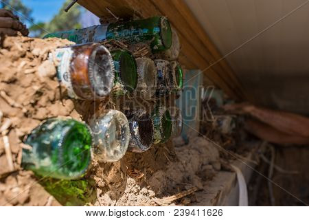 Bottle Wall And Cob, Ecologycal, Recycling Building Techonology. Traditional Cob Wall Construction W