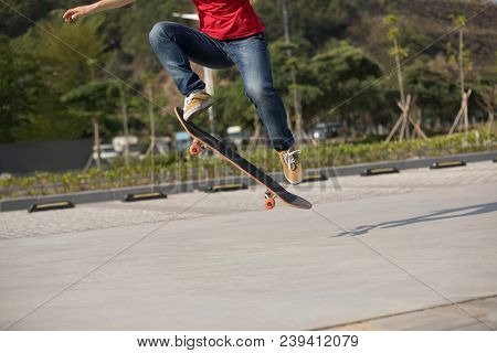 One Young Skateboarder Sakteboarding On Parking Lot