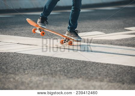 One Young Skateboarder Sakteboarding On Highway Road