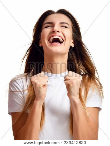 Brunette Woman Doing A Winner Gesture Happy Laughing Excited Looking Up With Closed Eyes Isolated On