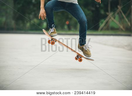 One Young Skateboarder Sakteboarding On Parking Lot