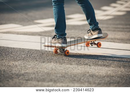 One Young Skateboarder Sakteboarding On High Way