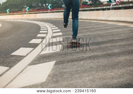 One Woman Skateboarder Legs Sakteboarding On Highway