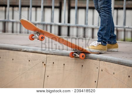 One Young Skateboarder Sakteboarding On Skatepark Ramp