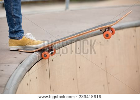 One Young Skateboarder Sakteboarding On Skatepark Ramp