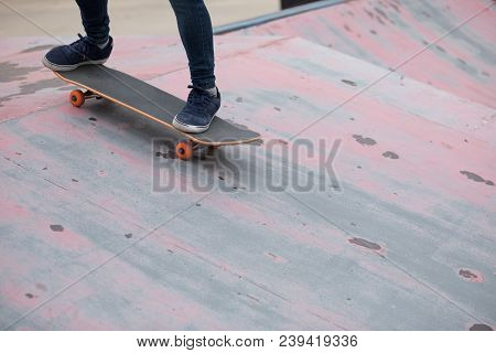 One Young Skateboarder Sakteboarding On Skatepark Ramp