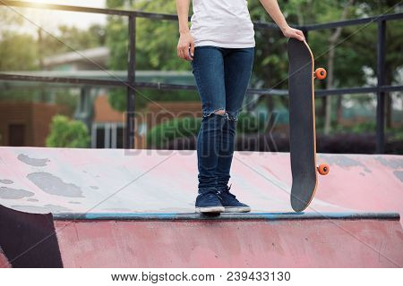 One Young Skateboarder Sakteboarding On Skatepark Ramp