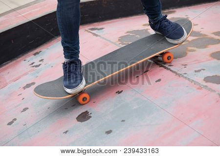 One Young Skateboarder Sakteboarding On Skatepark Ramp