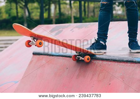 One Young Skateboarder Sakteboarding On Skatepark Ramp