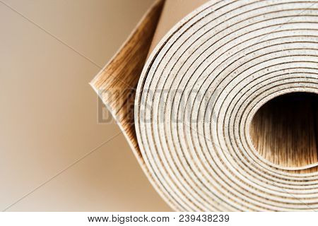 Roll Of Linoleum On A White Background