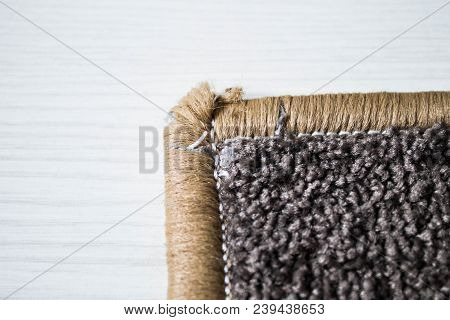 Home Floor Carpet With Overlock On White Laminate.