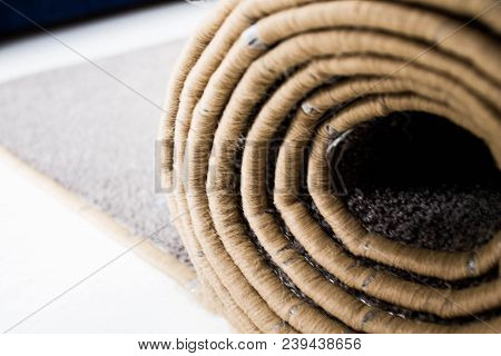 Home Floor Carpet With Overlock On White Laminate.