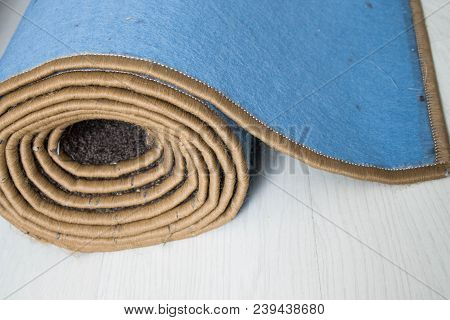 Home Floor Carpet With Overlock On White Laminate.