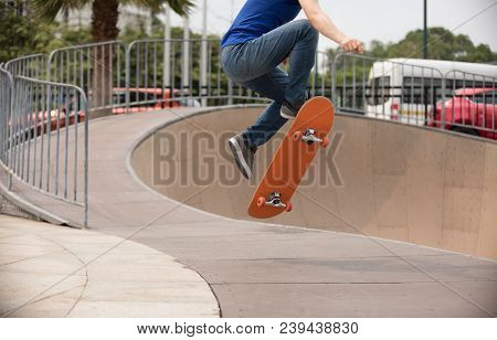 One  Young Skateboarder Sakteboarding On Skatepark Ramp