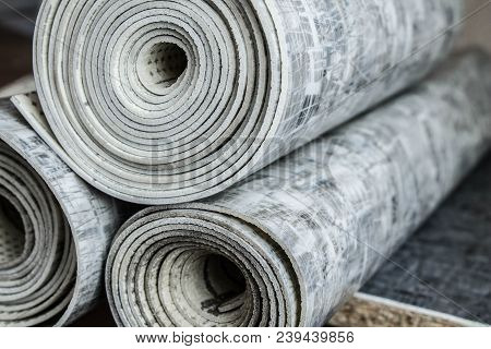 Gray Linoleum Rolled Up, Cut Into Pieces