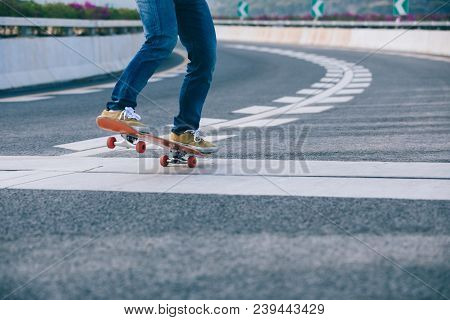 Closeup Of Skateboarder Sakteboarding On City Highway