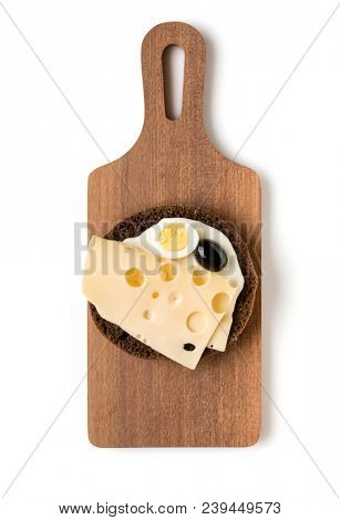 Open  faced cheese sandwich canape or crostini on a wooden serving board  isolated on white background closeup. Top view. Vegetarian tartarine.