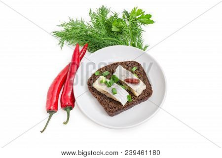 Open Sandwich Made Of Brown Bread And Slices Of Fillet Of Pickled Atlantic Herring On A Saucer, Two 