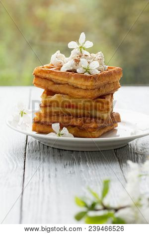 On Saucer In Spring Composition On Wooden Background.spring Still Life With Cherry Blossoms