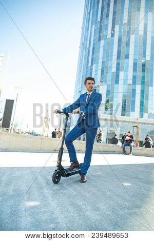 Using Electric Scooter On The Street