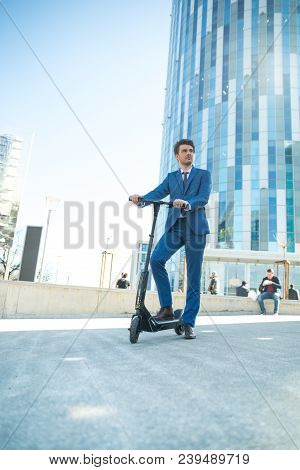 Using Electric Scooter On The Street