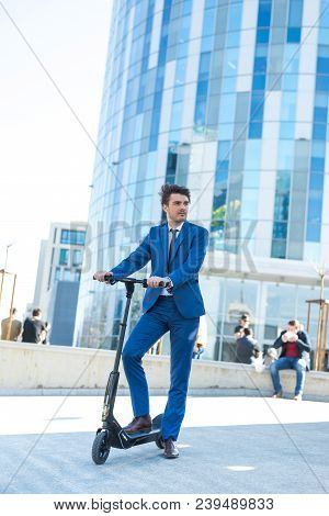Using Electric Scooter On The Street