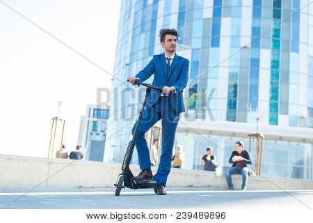 Using Electric Scooter On The Street
