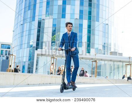 Using Electric Scooter On The Street