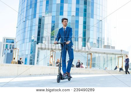 Using Electric Scooter On The Street