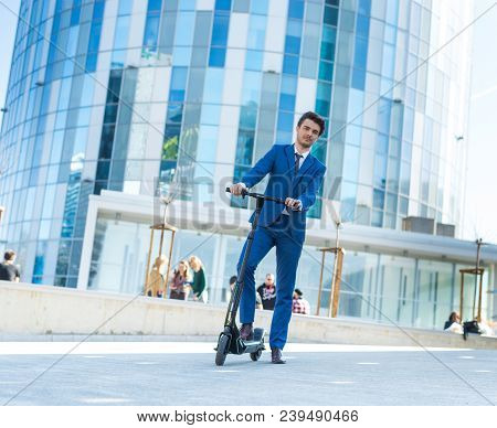 Using Electric Scooter On The Street