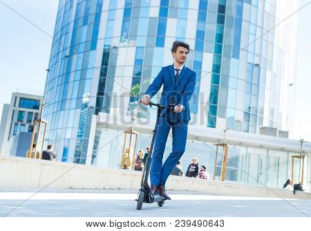 Using Electric Scooter On The Street