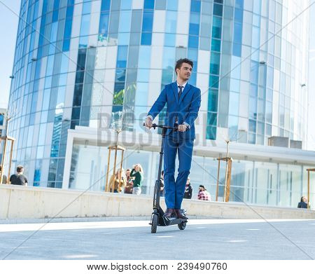 Using Electric Scooter On The Street