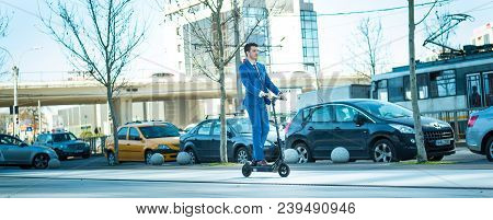 Using Electric Scooter On The Street