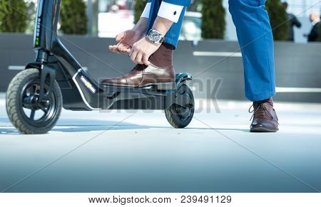 Using Electric Scooter On The Street