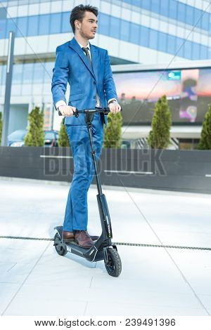 Using Electric Scooter On The Street