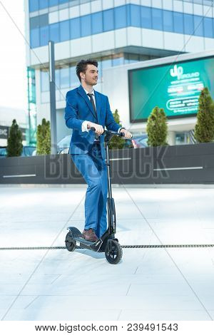 Using Electric Scooter On The Street