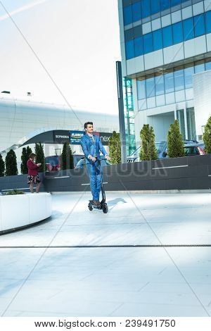 Using Electric Scooter On The Street