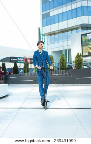 Using Electric Scooter On The Street