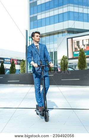 Using Electric Scooter On The Street