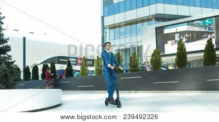 Using Electric Scooter On The Street
